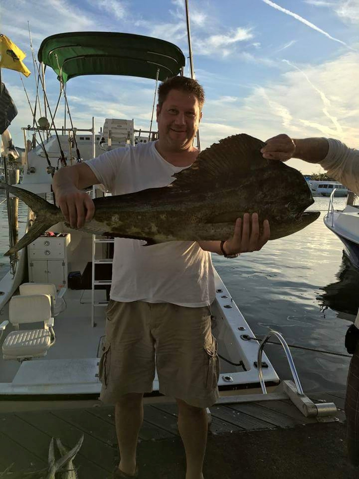 a person standing next to a boat